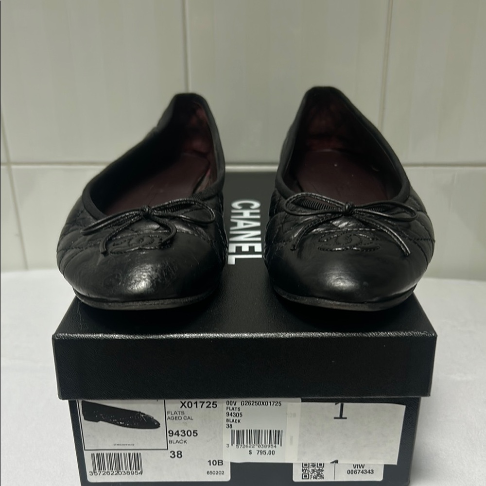 CHANEL Black Flats with Bow Accent